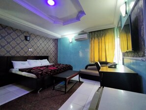 Suite | Living room | 32-inch LED TV with satellite channels, TV - Orient Hotel & Plaza (Abuja)