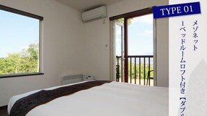 A hotel room with a bed, an air conditioning unit, and a balcony with a view of trees. - Chalet Fuyuri (Furano)
