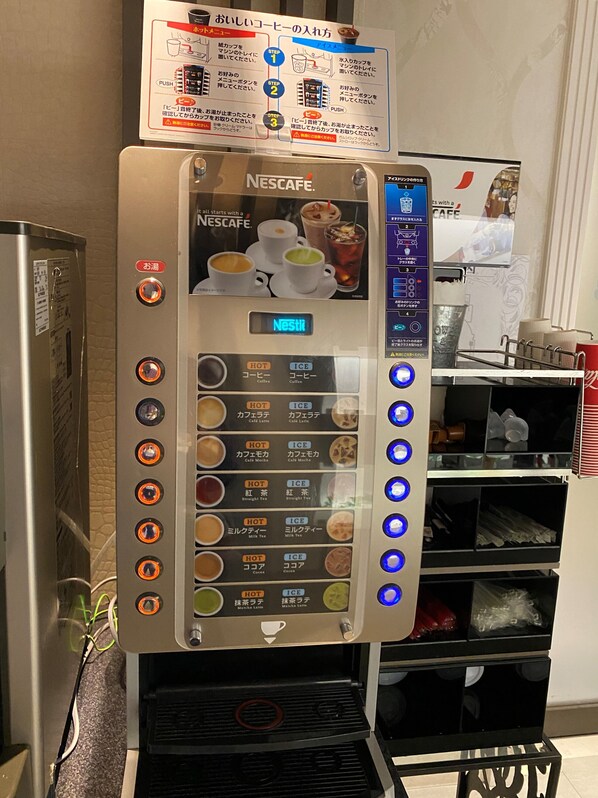 A Nescafe coffee machine with multiple drink options and a digital display. - Hotel venus NEO - Adults Only (Nagoya)