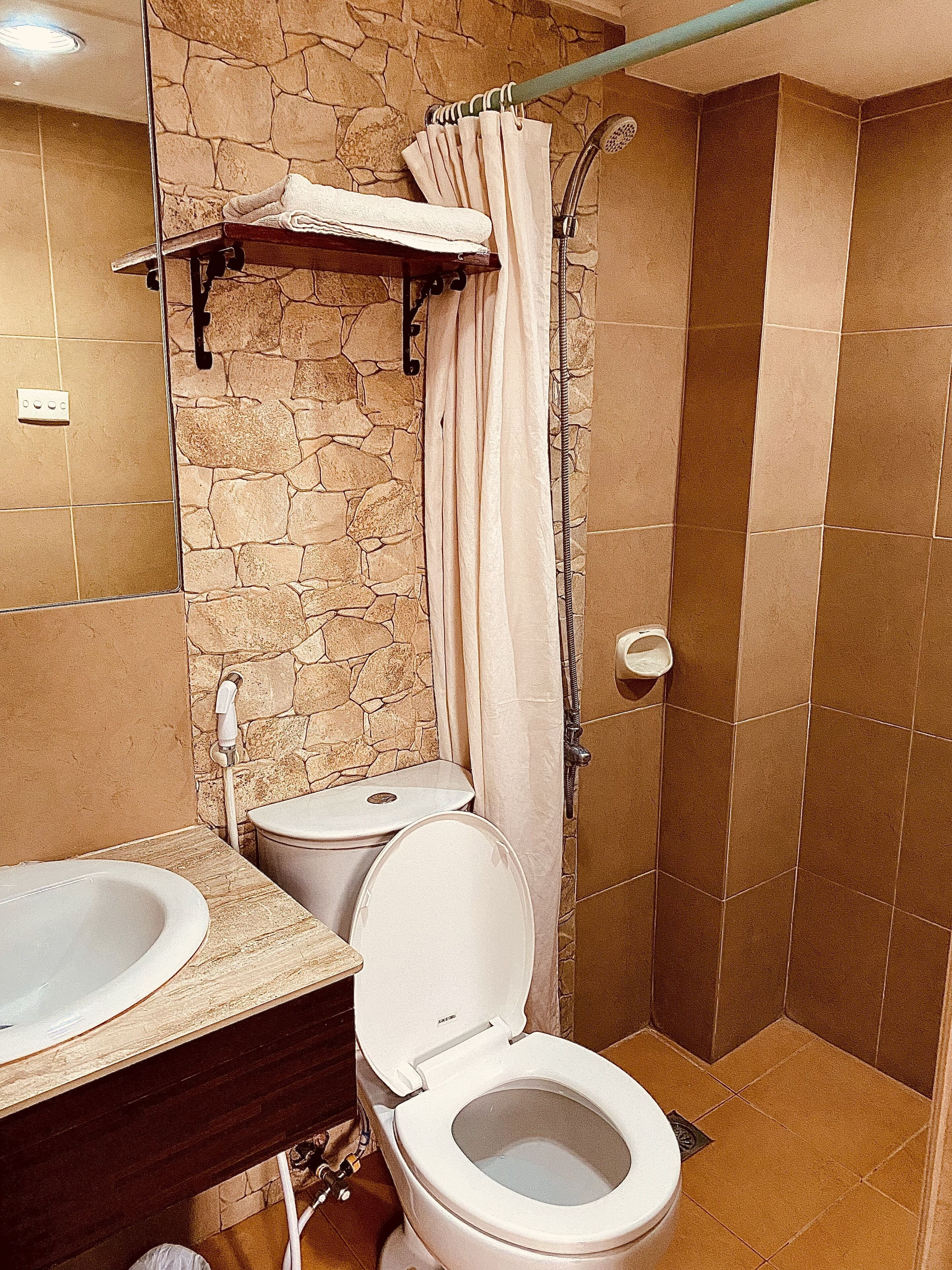 shower, designer toiletries, hair dryer, slippers