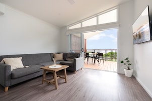 Premium Beachfront Villa, 2 Bedrooms | Living area | Flat-screen TV