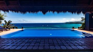 Outdoor pool, pool umbrellas, sun loungers