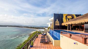 Outdoor pool, pool umbrellas, sun loungers