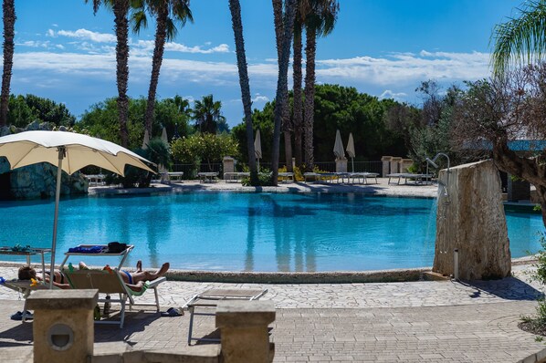 Seasonal outdoor pool, open 10:30 AM to 6:30 PM, pool umbrellas