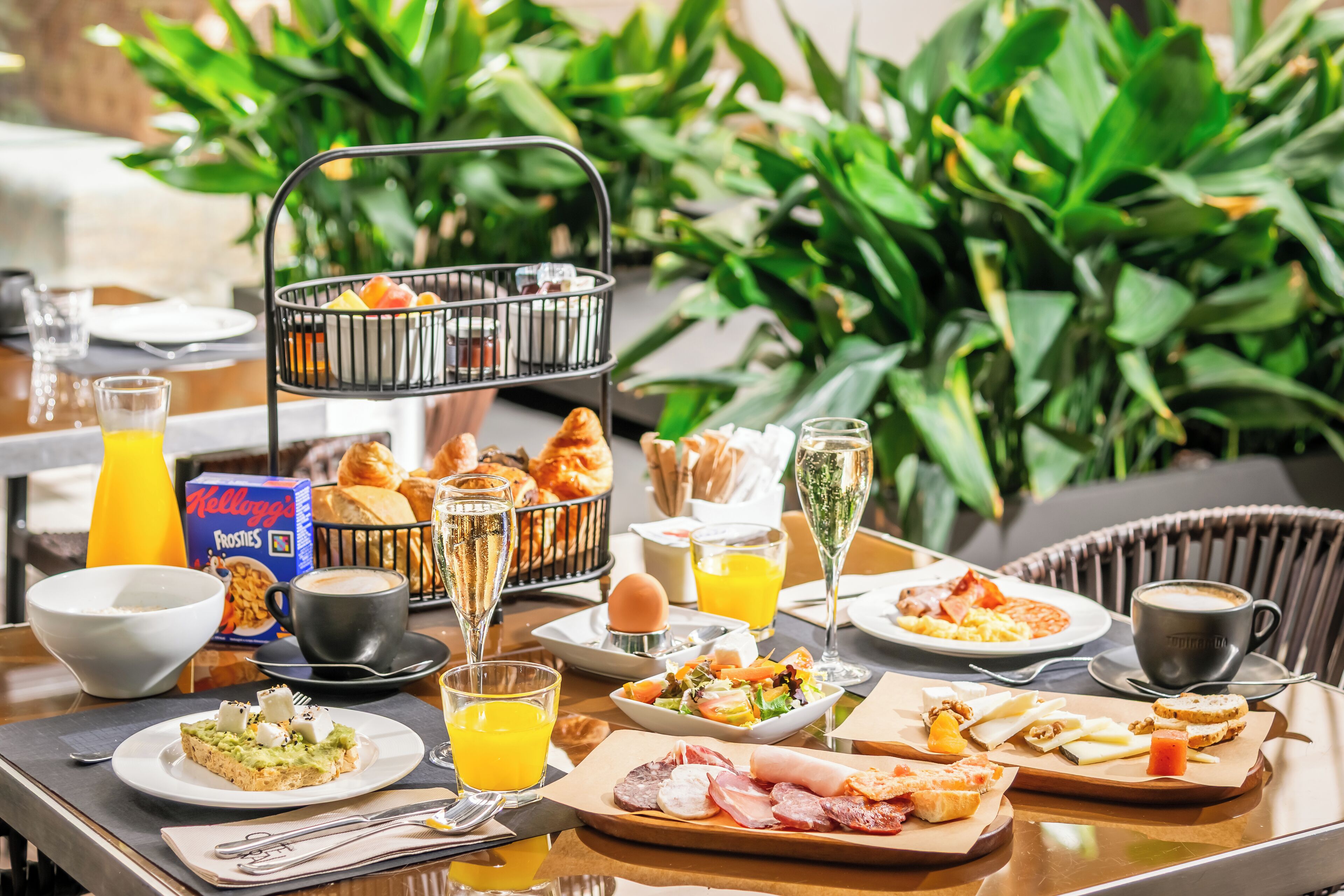 A breakfast buffet with various food items and beverages.
