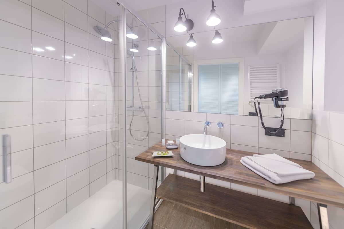 premium room | bathroom | shower, free toiletries, hair dryer, bathrobes