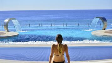 Indoor pool, outdoor pool, pool umbrellas, sun loungers