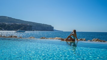 Indoor pool, seasonal outdoor pool, pool umbrellas, pool loungers