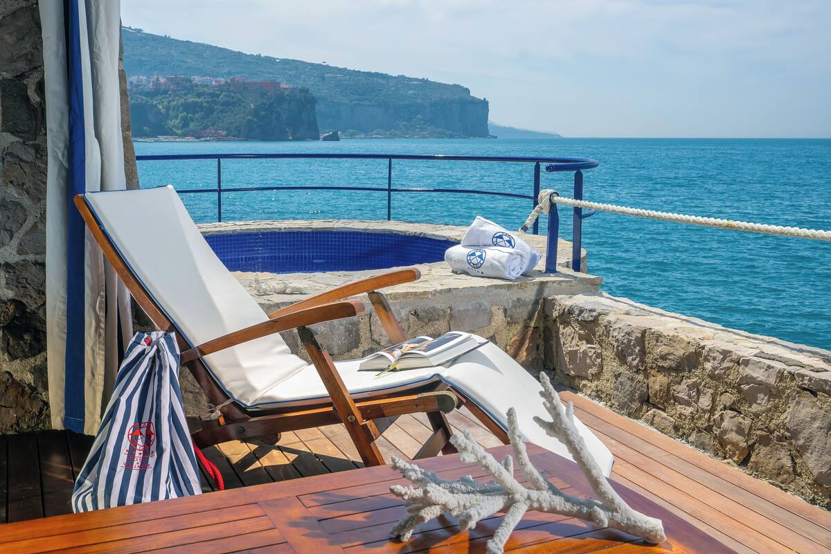 Camera Infinity con vista mare terrazza-patio e jacuzzi privata esterna | Teras/patio