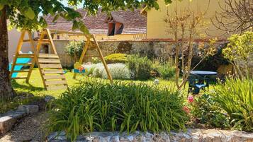 Escape to a serene garden oasis with lush greenery and a tranquil atmosphere, perfect for outdoor dining or relaxation.