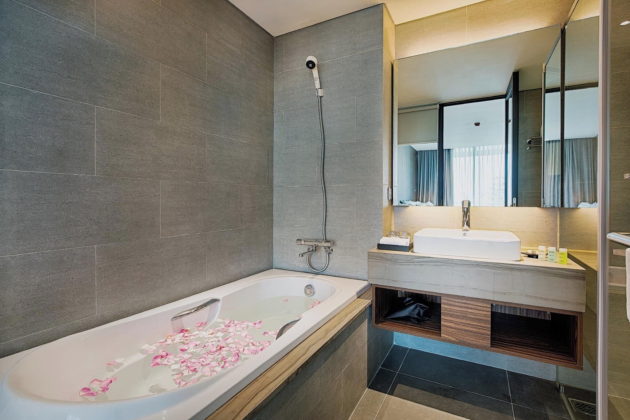 family room, multiple beds, non smoking, river view | bathroom | designer toiletries, hair dryer, slippers, bidet