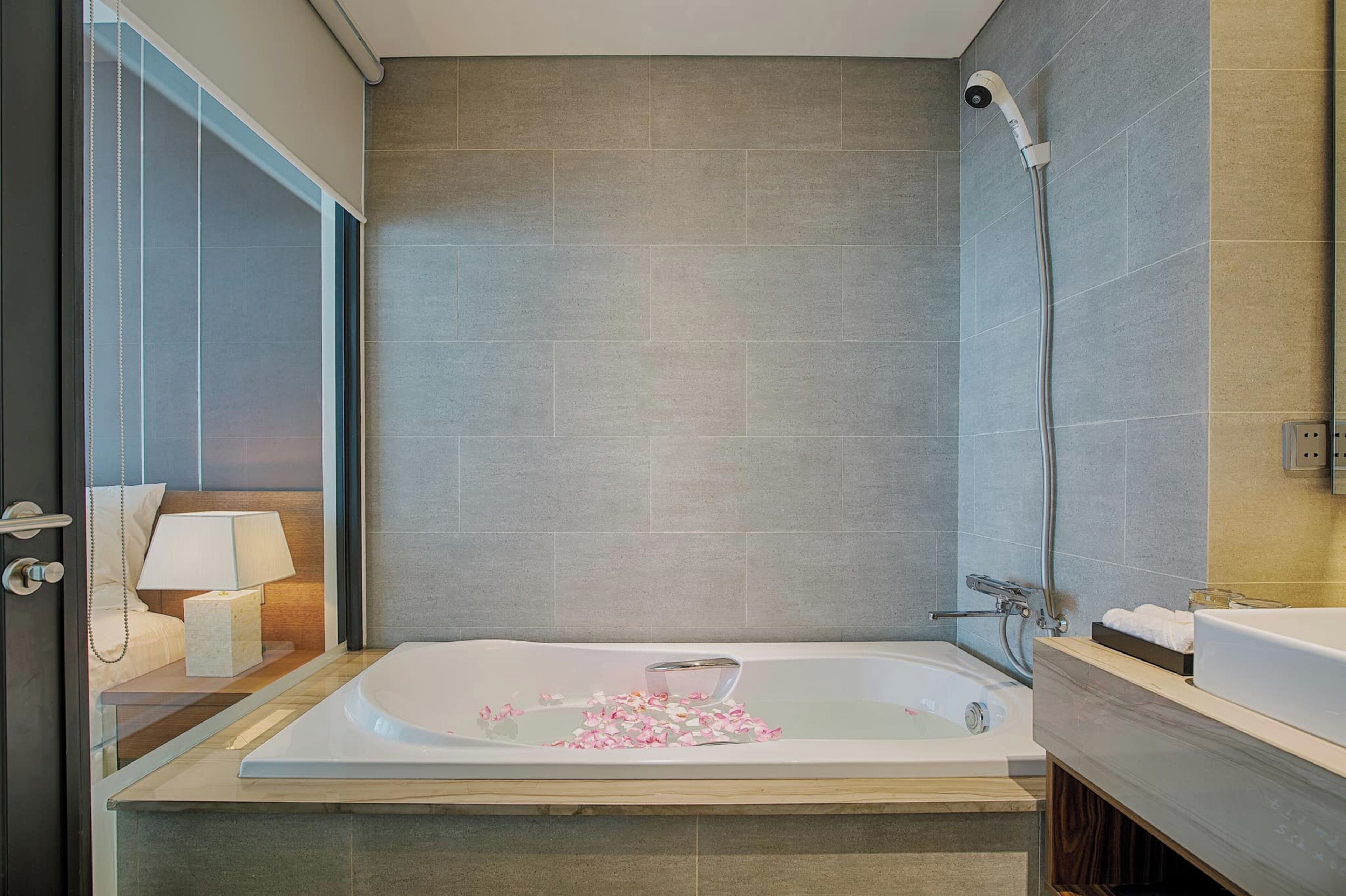 family room, multiple beds, non smoking, river view | bathroom | designer toiletries, hair dryer, slippers, bidet