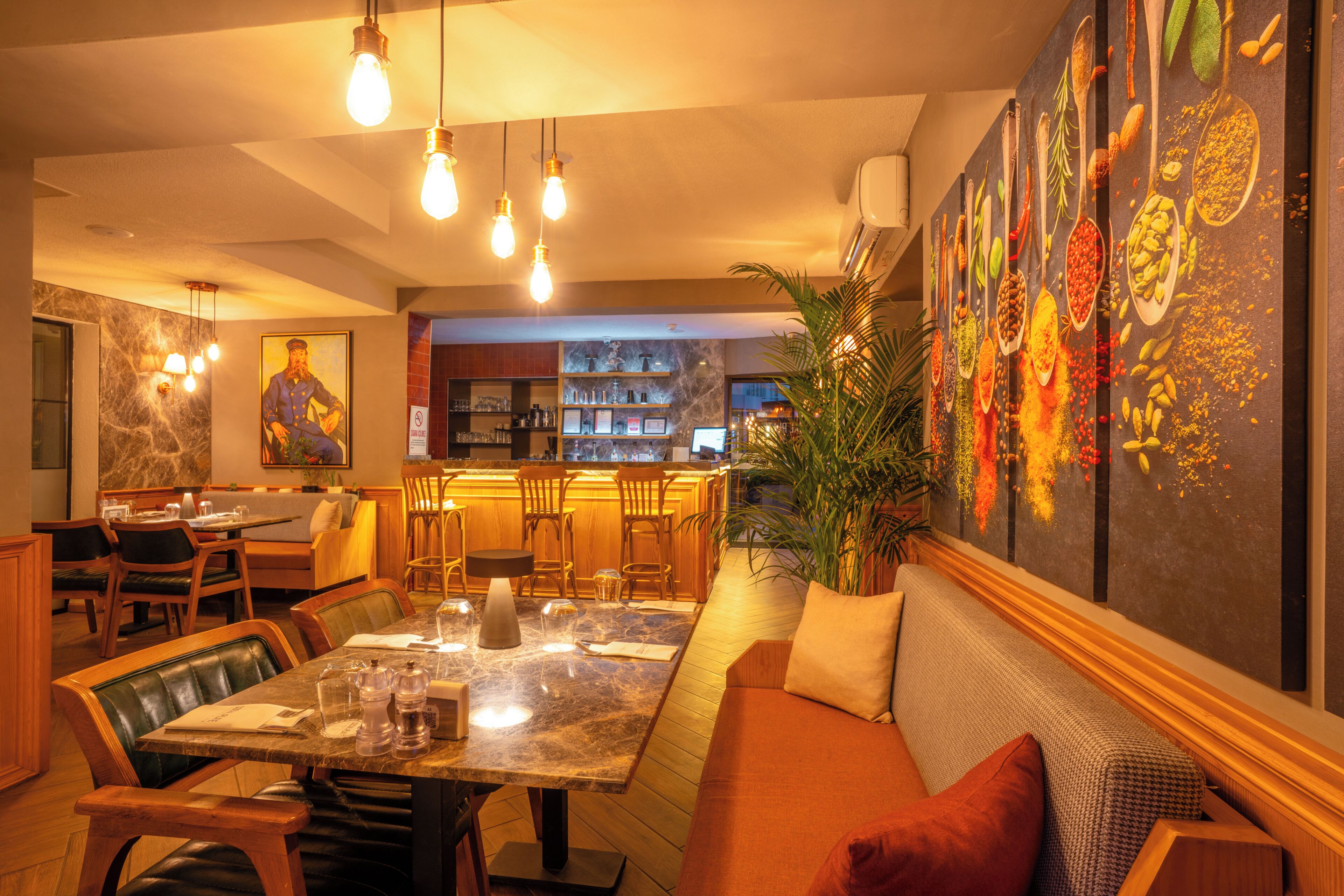 A restaurant with a dining area, bar, and kitchen.