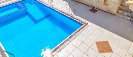 Indoor pool, outdoor pool, pool umbrellas, sun loungers