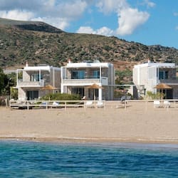 On the beach, white sand, sun-loungers, beach umbrellas