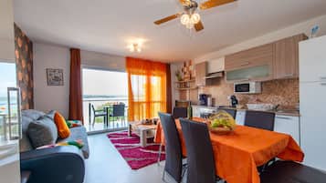 Superior Apartment, 3 Bedrooms, Balcony, Sea View | Living room | Flat-screen TV, DVD player