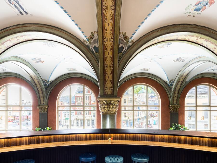 A bar area with arched windows and a central column.
