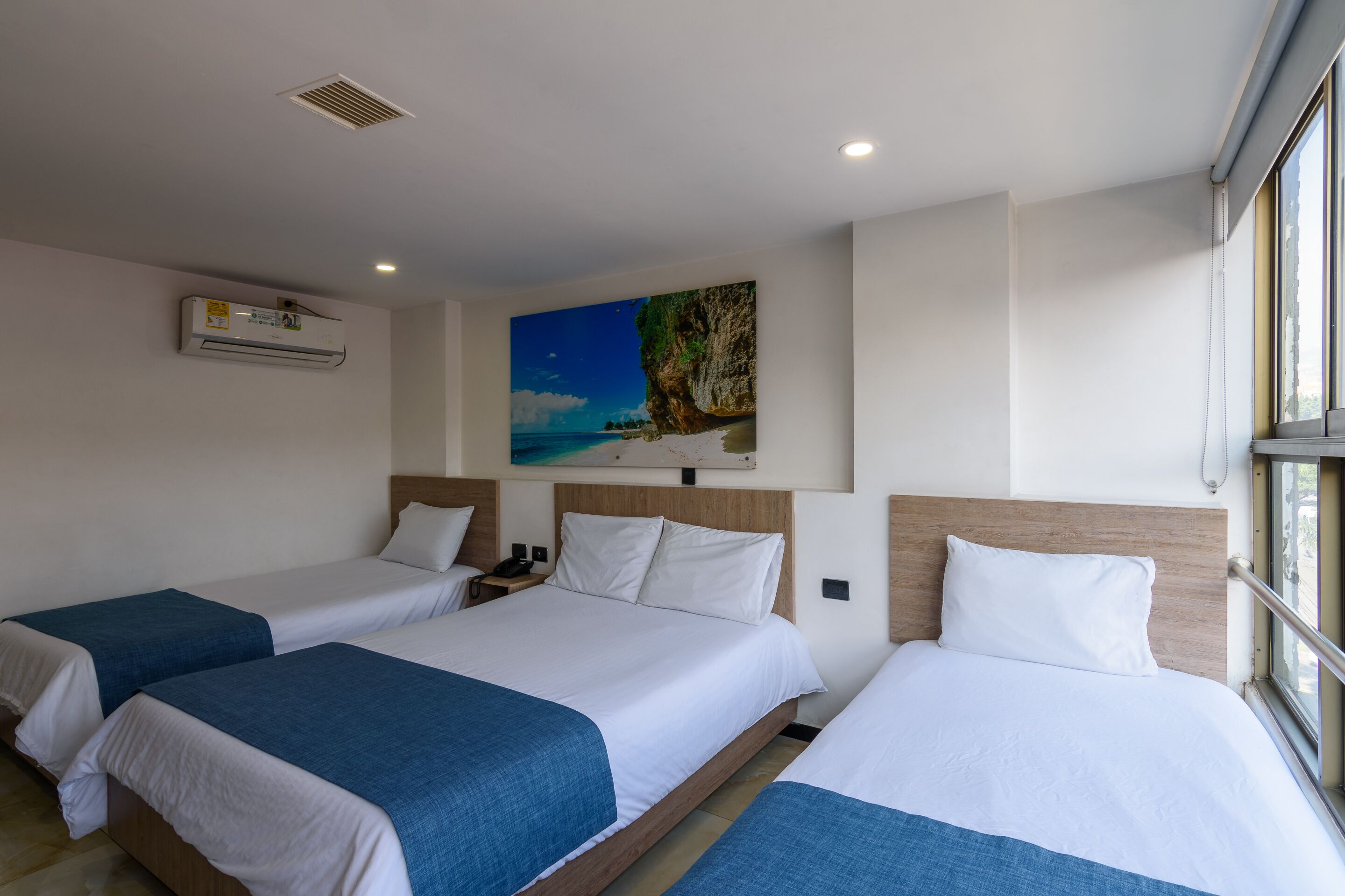 triple room | premium bedding, desk, laptop workspace, iron/ironing board