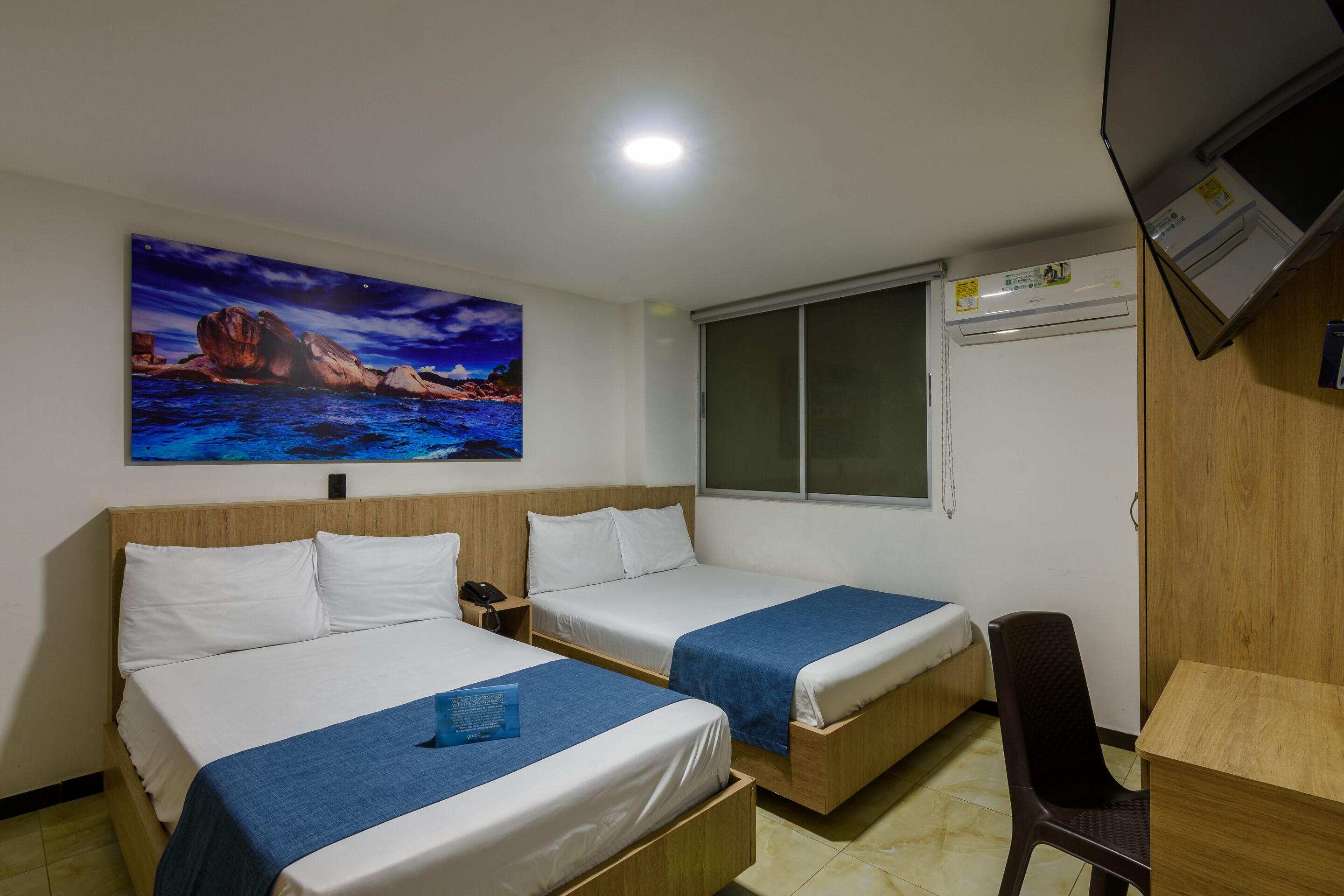 family double room | premium bedding, desk, laptop workspace, iron/ironing board