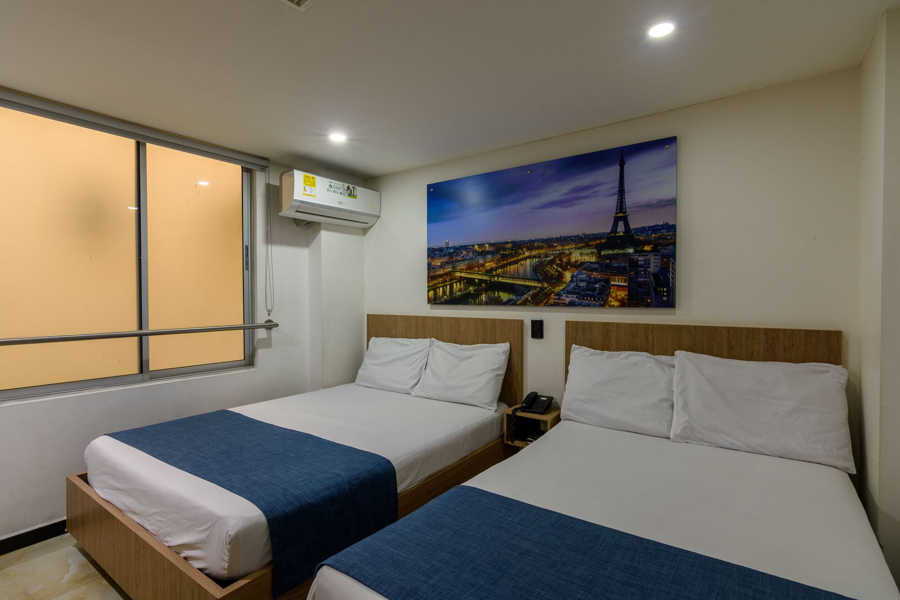 family double room | premium bedding, desk, laptop workspace, iron/ironing board