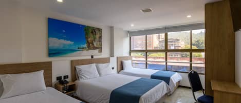 Premium bedding, desk, laptop workspace, iron/ironing board