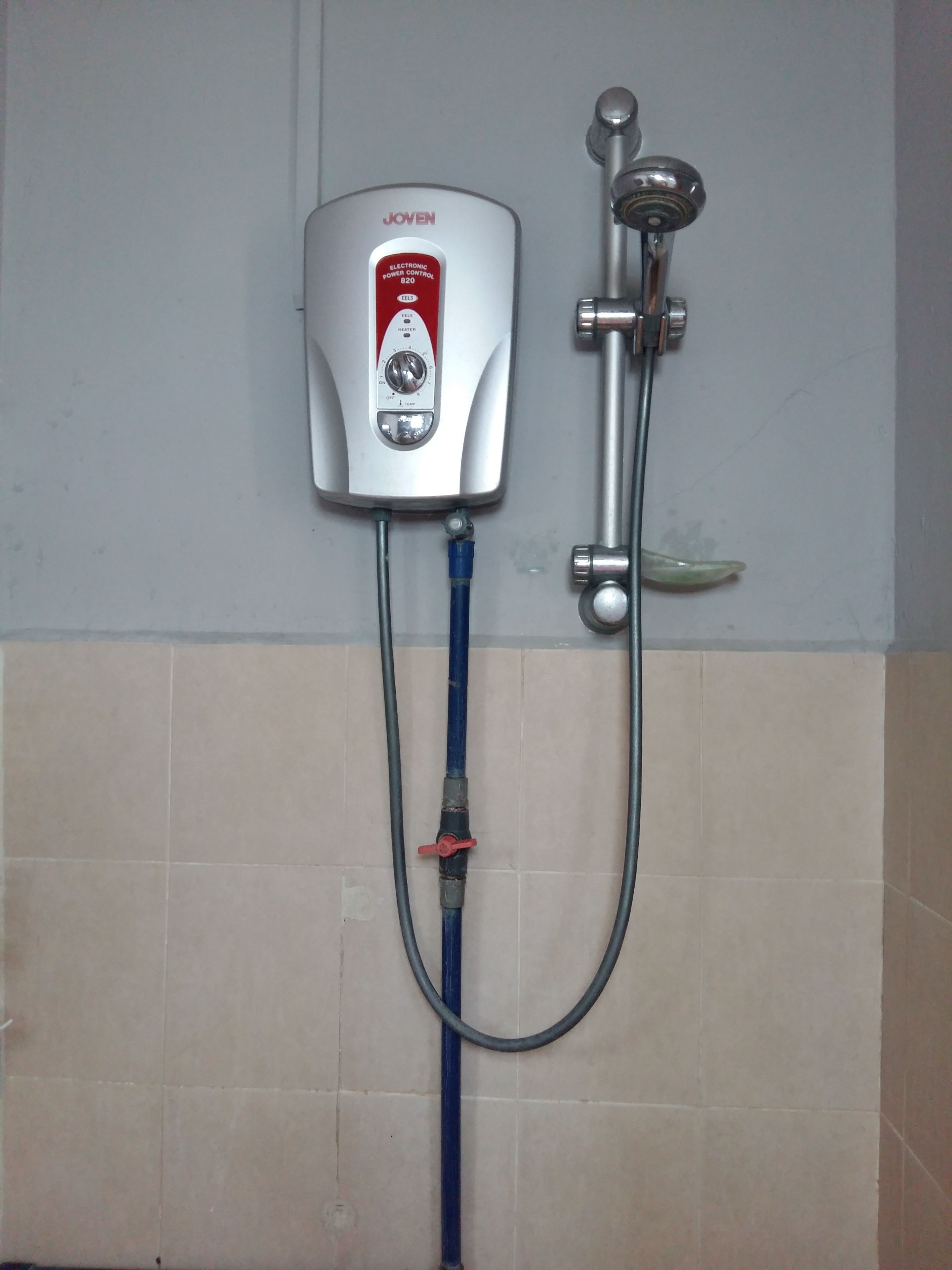 A Joven electronic power control unit with a shower head and hose.