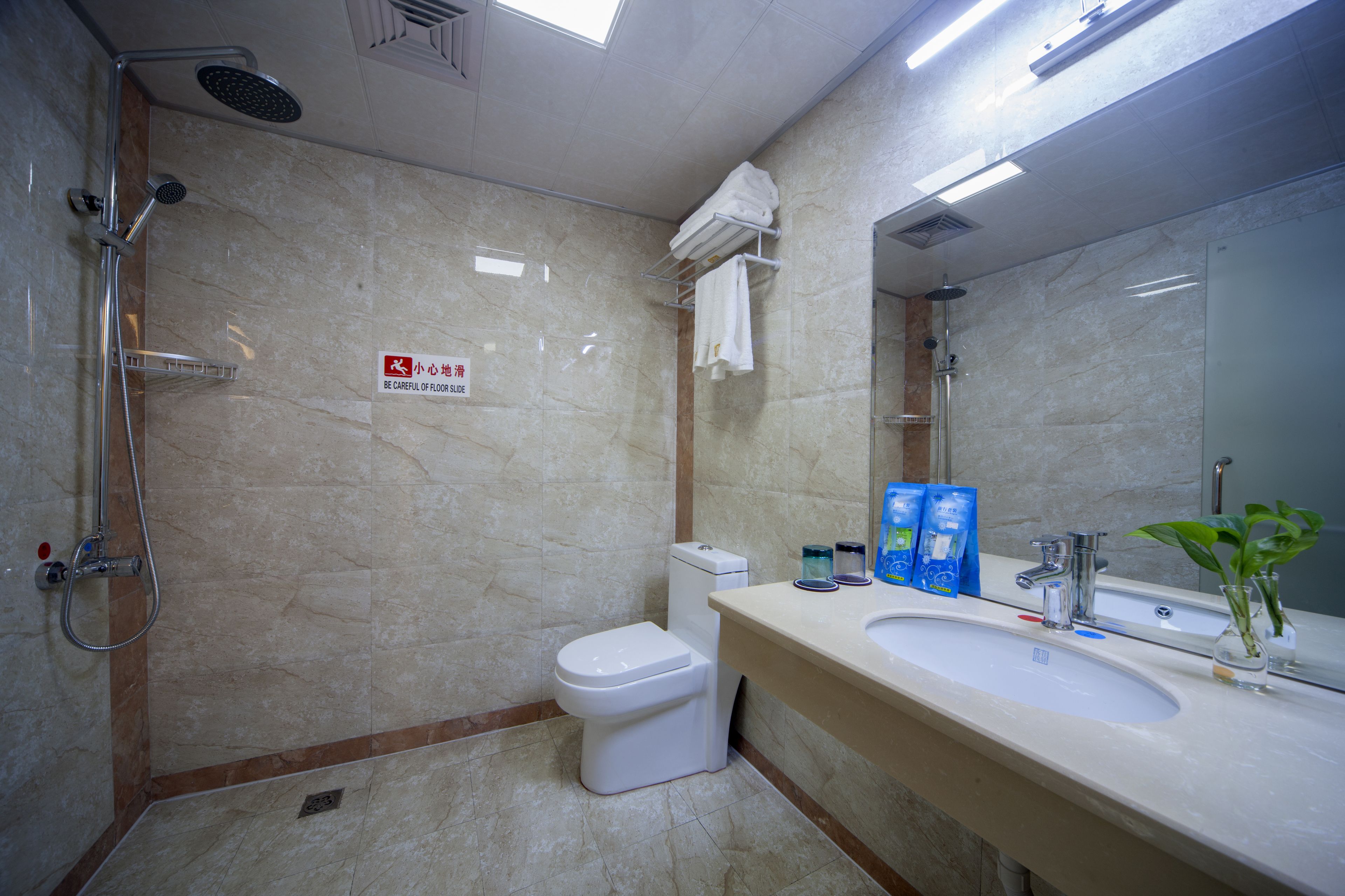 deluxe twin room | bathroom | shower, free toiletries, slippers, towels