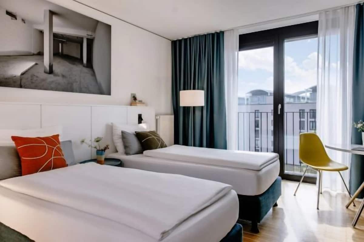 Premium bedding, down comforters, in-room safe, desk