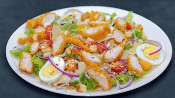 A plate of salad with various ingredients.