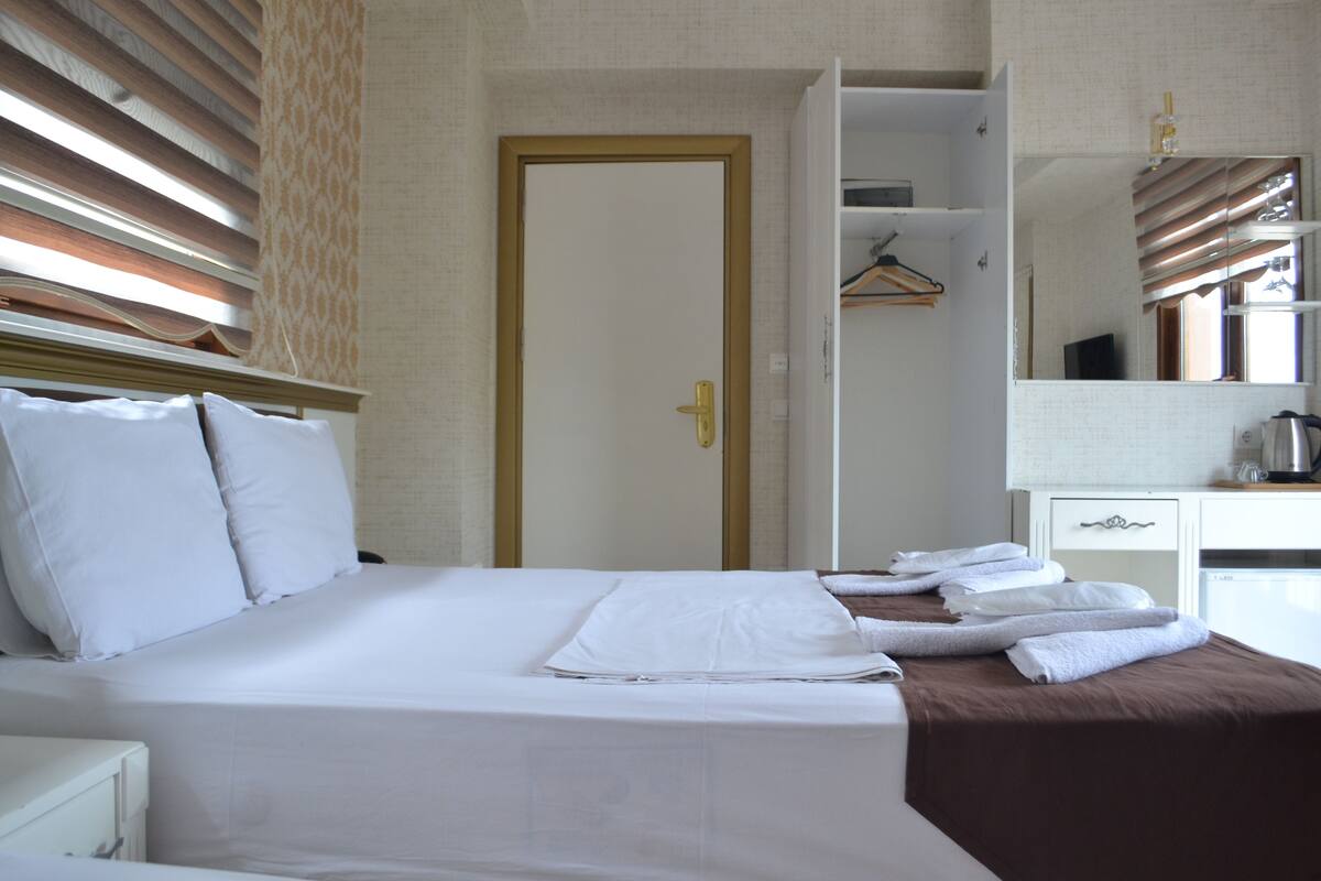 Triple Room, City View | In-room safe, desk, laptop workspace, soundproofing