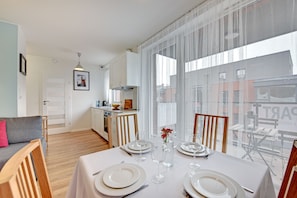 Apartment, 1 Bedroom, Lake View | Living room | Flat-screen TV
