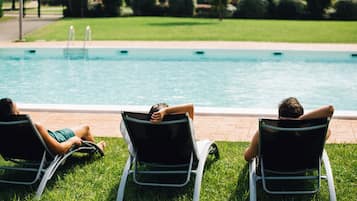 Seasonal outdoor pool, pool loungers
