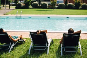 Seasonal outdoor pool, pool loungers
