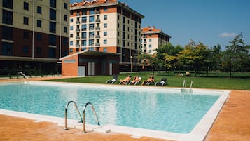 Seasonal outdoor pool, pool loungers