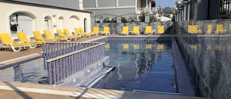 Outdoor pool, pool umbrellas, pool loungers