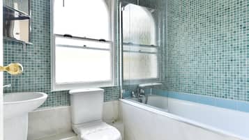 Apartment, 2 Bedrooms | Bathroom | Combined shower/tub, deep soaking tub, hair dryer, towels