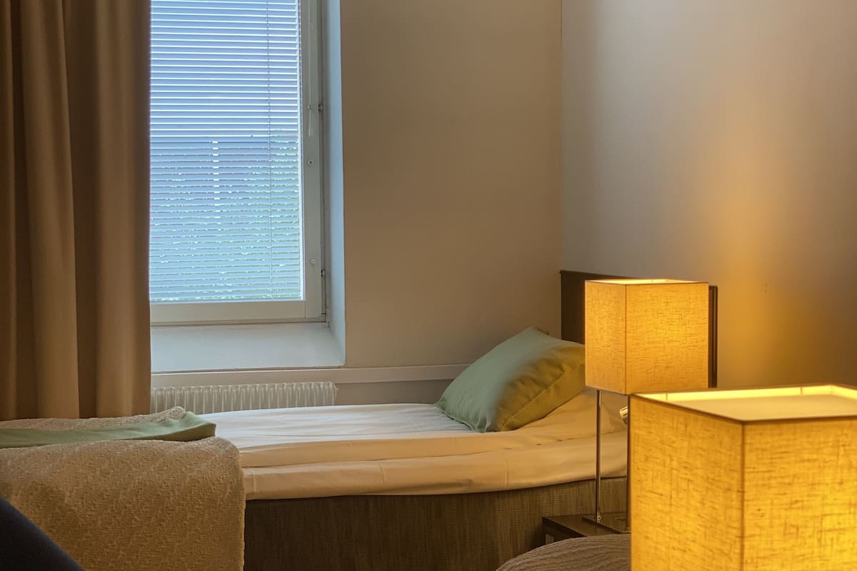 Economy Double Room | 1 bedroom, blackout drapes, cribs/infant beds, bed sheets