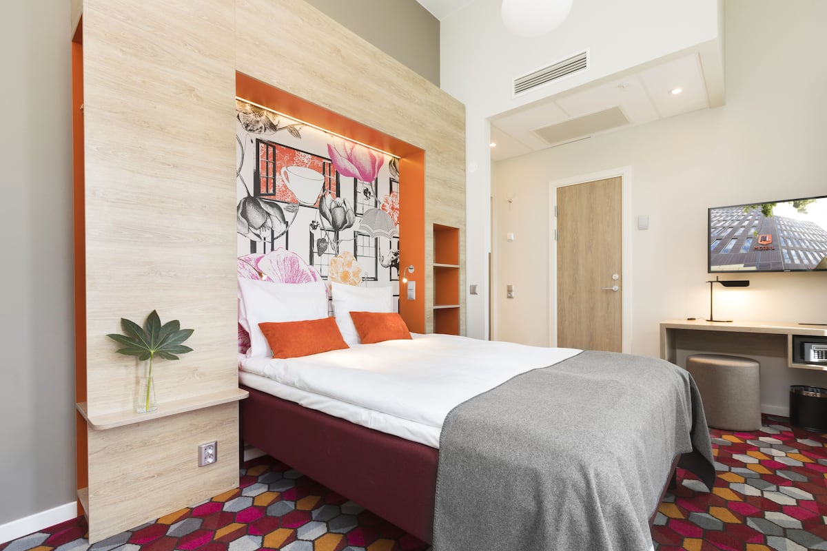 stylish double room | in-room safe, desk, blackout curtains, free cots/infant beds