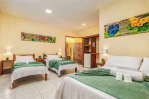 Family Room, Multiple Beds, Balcony | Minibar, laptop workspace, WiFi (free), bed sheets - Pousada Búzios Garden (Búzios)