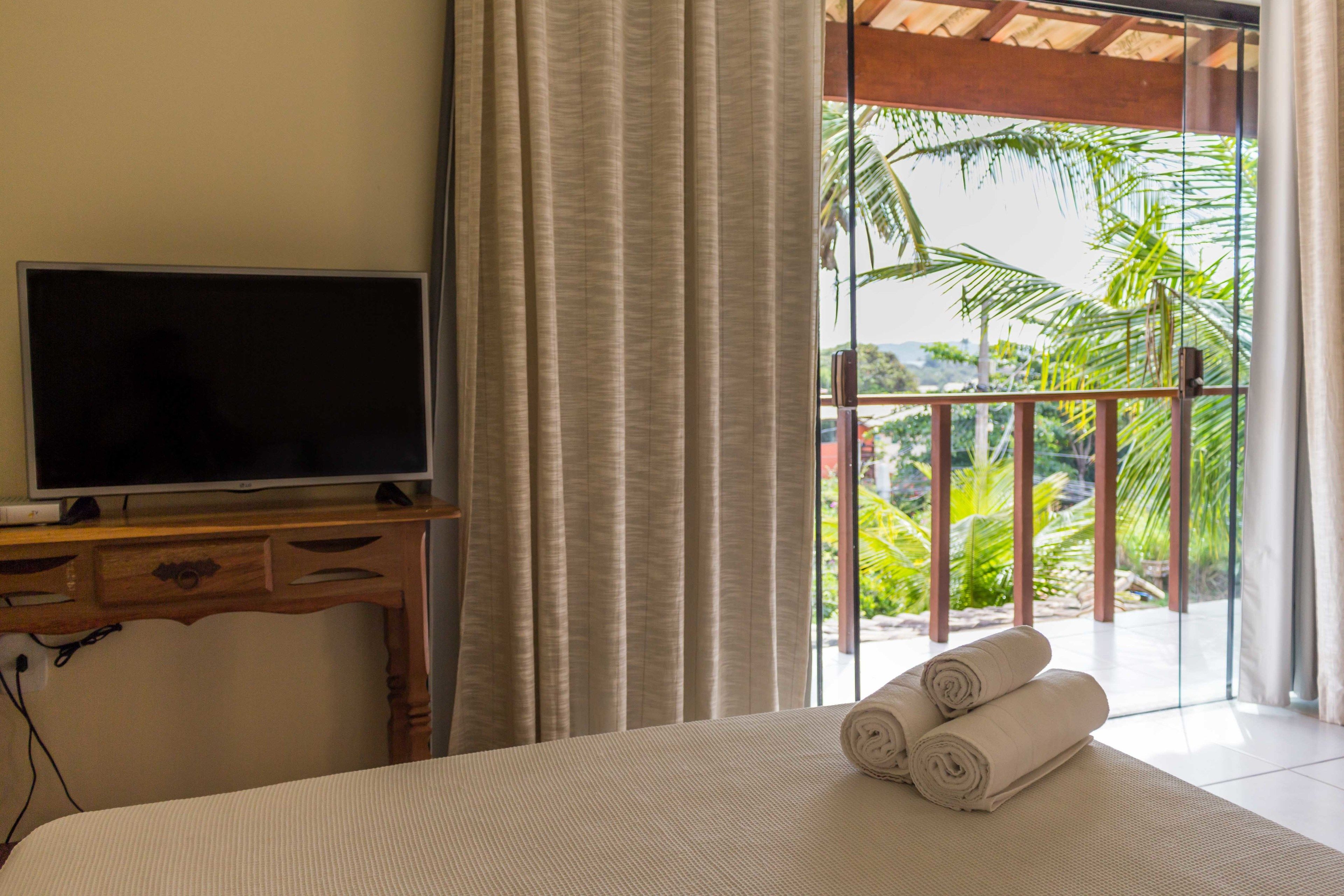 Quarto família, várias camas, sacada | Frigobar, espaço de trabalho para notebook, Wi-Fi de cortesia