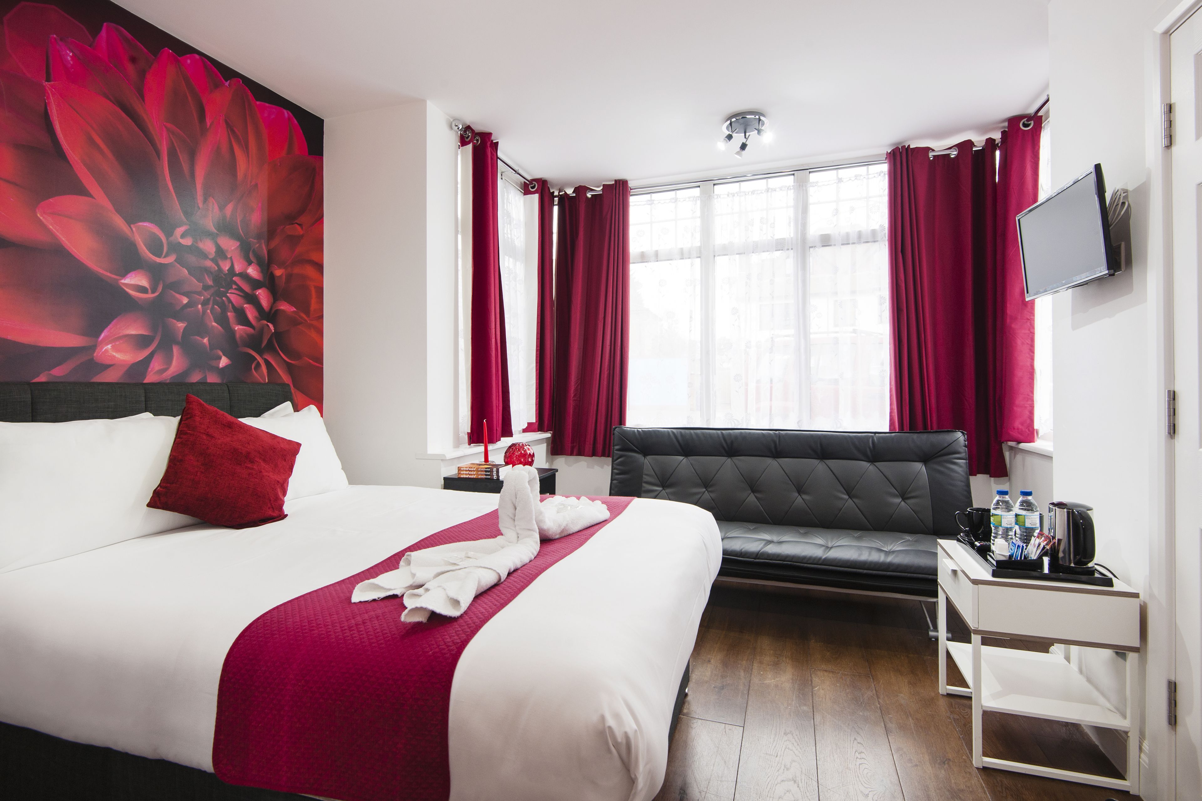 Deluxe driepersoonskamer, meerdere bedden | 1 slaapkamer, een strijkplank/strijkijzer, gratis wifi, beddengoed