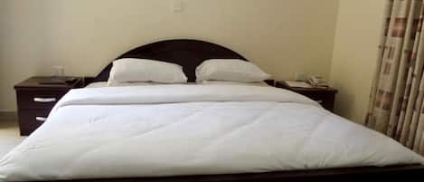 Desk, laptop workspace, bed sheets