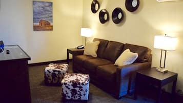 Premium bedding, desk, laptop workspace, iron/ironing board