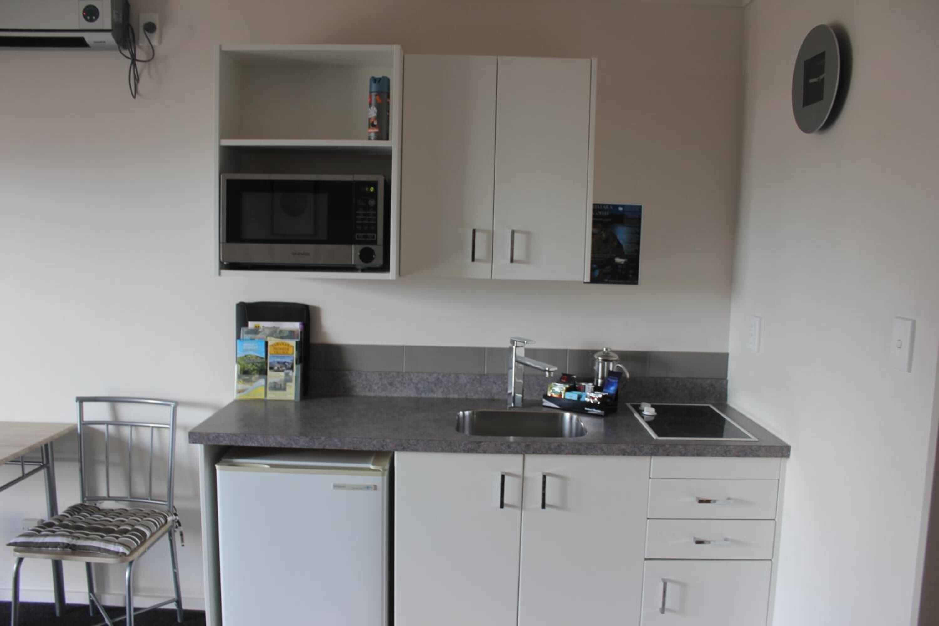 Fridge, microwave, stovetop, coffee/tea maker