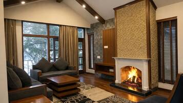 Luxury Suite, 1 King Bed | Living area | 40-inch LED TV with digital channels, TV