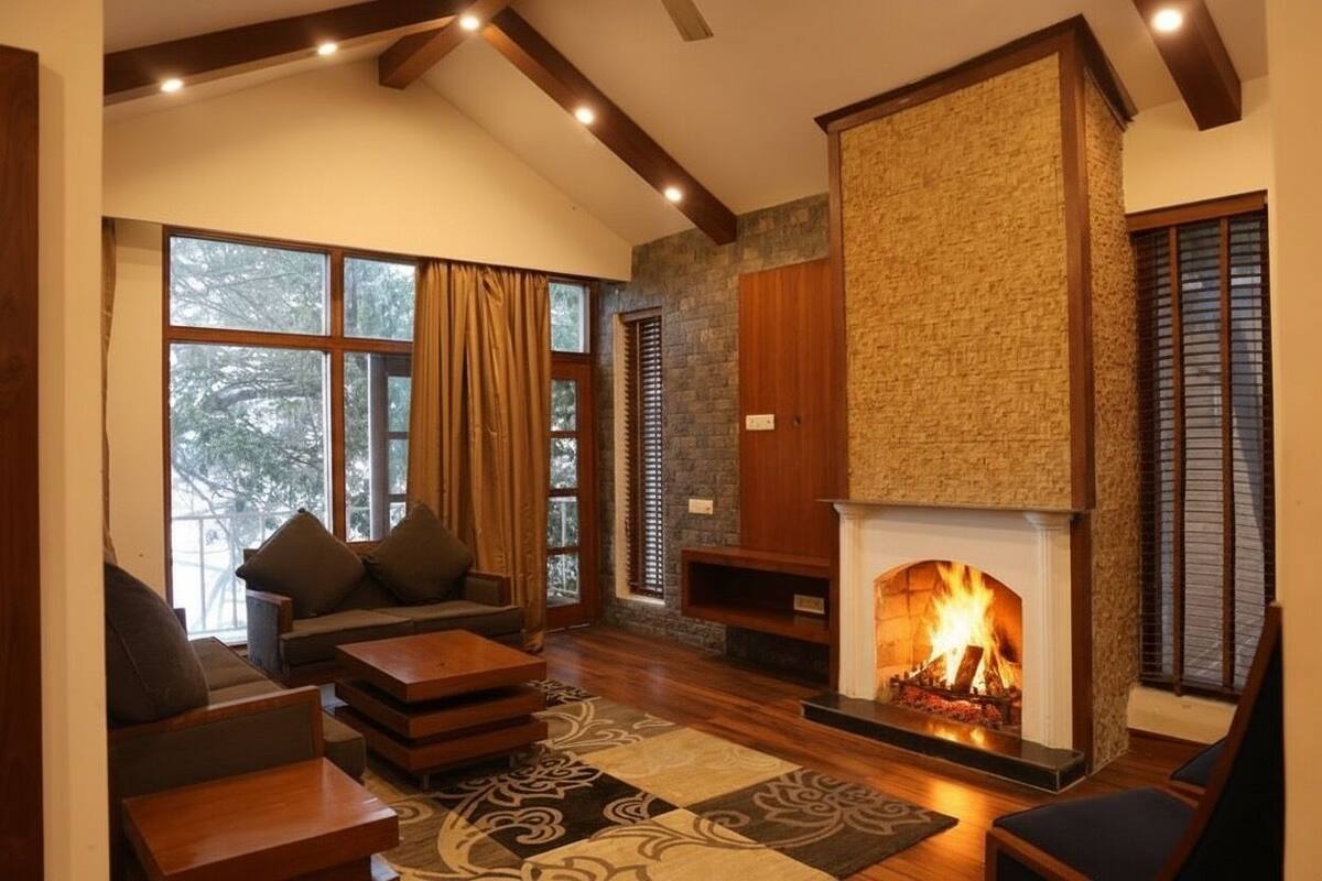 A cozy living room with a fireplace, wooden furniture, and large windows.