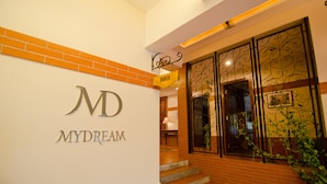 A hotel entrance with a sign reading "MYDREAM" and a "DOVER" sign above the door. - MyDream Homestay (Ipoh)