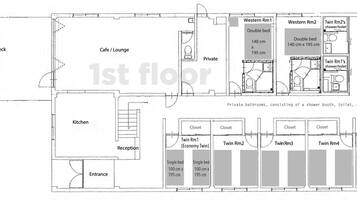 A hotel floor plan with a cafe/lounge, private rooms, a kitchen, and an entrance.
