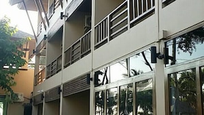 A multi-story building with balconies, large windows, and a flat roof. - La Playa Boutique Resort (Chonburi)