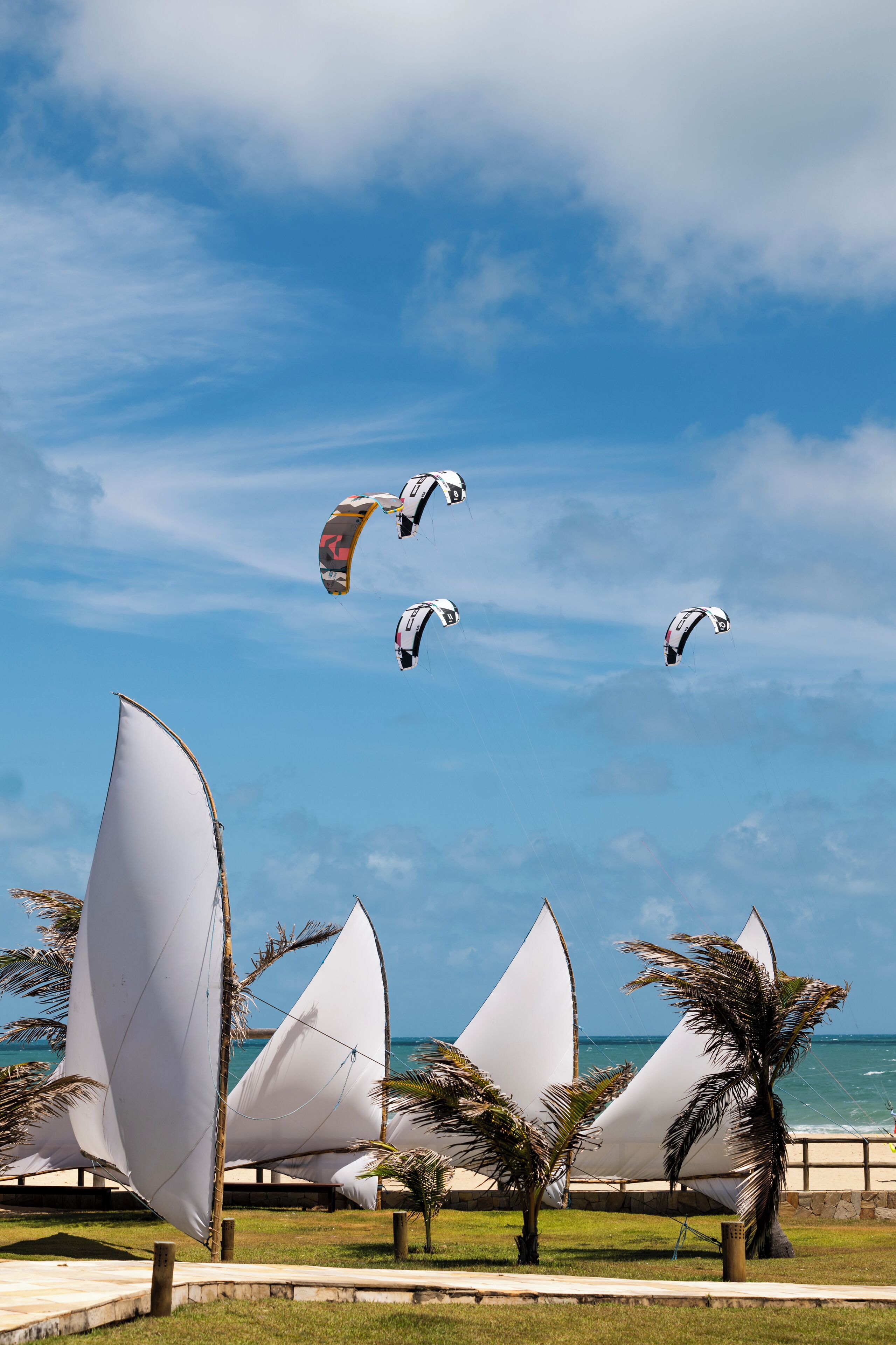 on the beach, beach shuttle, beach towels, windsurfing